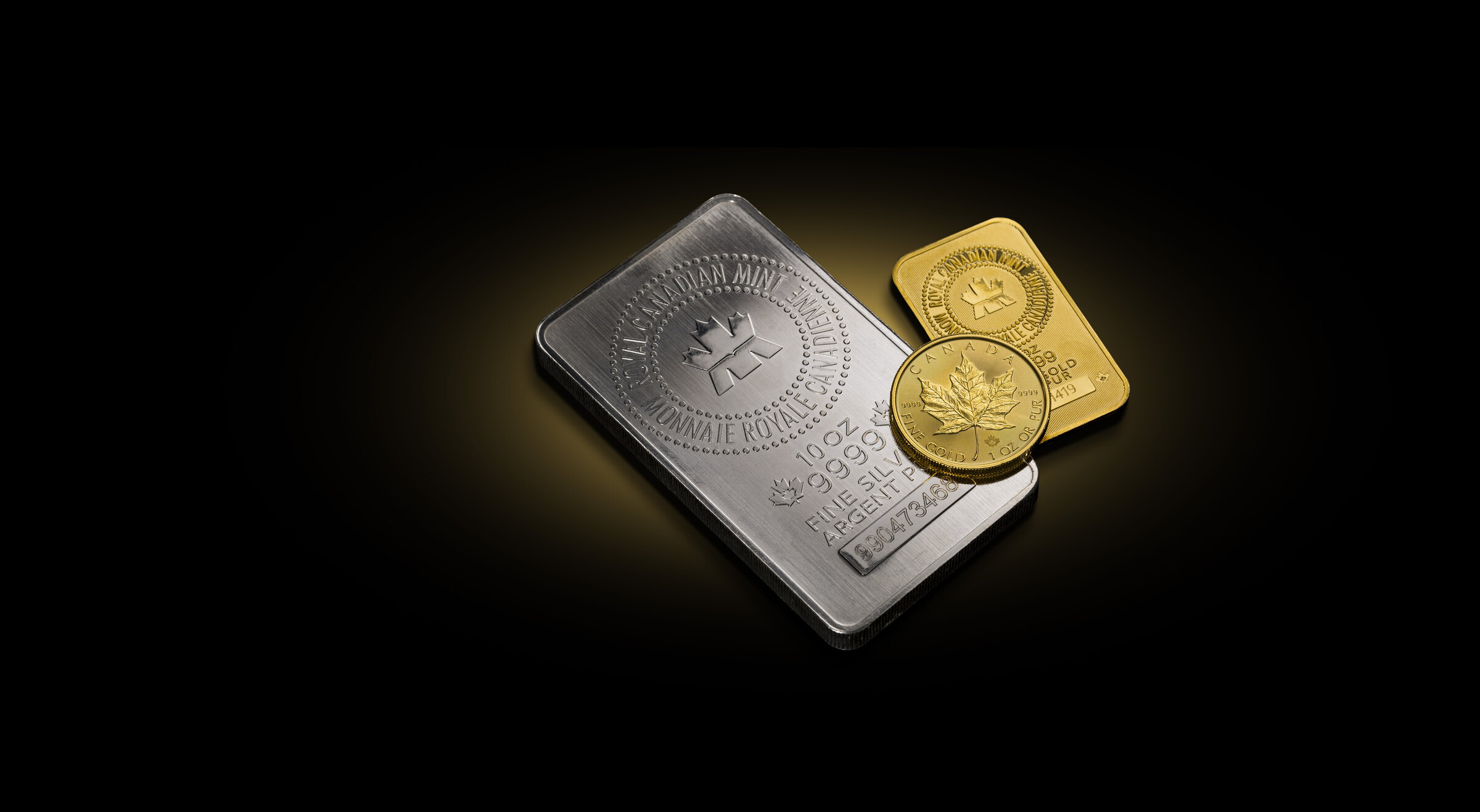 Royal Canadian Mint gold and silver bullion bars with gold maple leaf coin